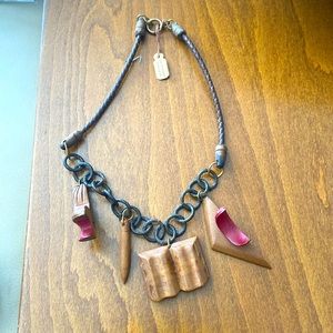 Leather & wood necklace w/ 4 wooden pendants: school desk, pencil, book, desk.